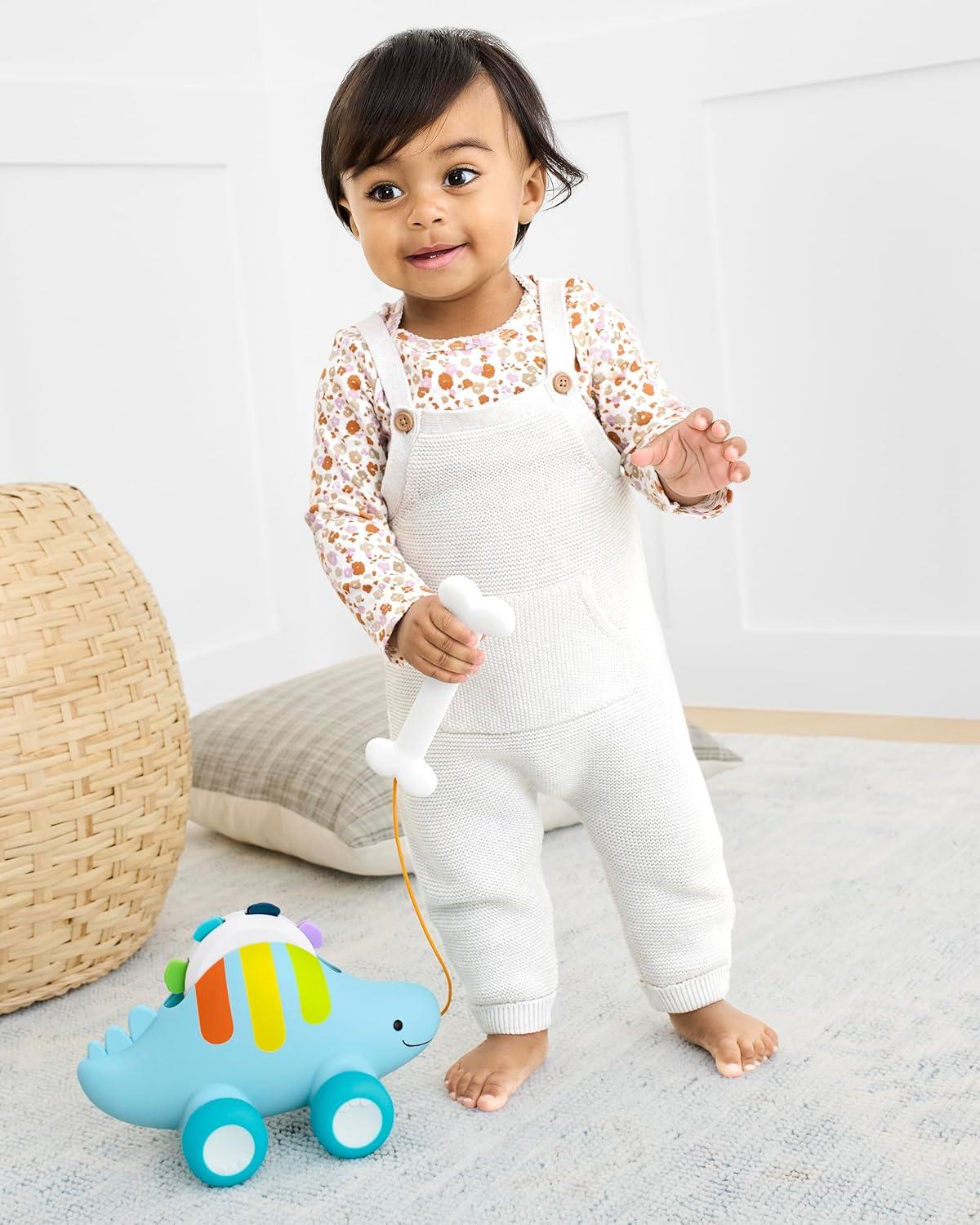 imageSkip Hop Dinosaur Pull Along Baby Musical Toy 3in1 Explore amp MoreDinosaur Pull Along